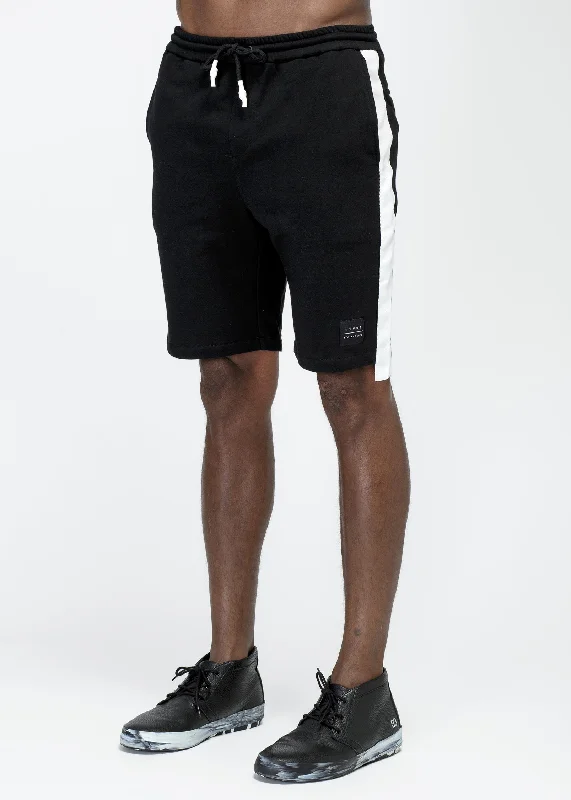 Men's ripped denim shorts for a trendy streetwear aesthetic Konus Men's Sweat Shorts w/ White Tape on Side in Black Men's ripped denim shorts for a trendy streetwear aesthetic Konus Men's Sweat Shorts w/ White Tape on Side in Black