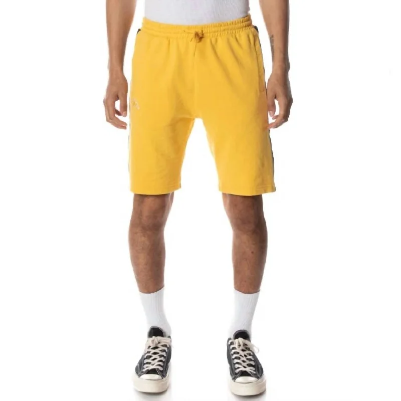 Men's adjustable - length convertible shorts for versatile use Logo Tape Dasved Shorts In Yellow/grey/black Men's adjustable - length convertible shorts for versatile use Logo Tape Dasved Shorts In Yellow/grey/black