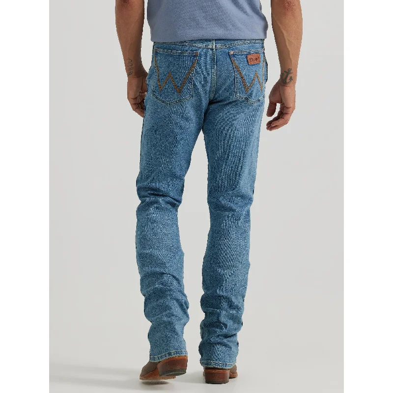 Men's Distressed Jeans with Patches for a Retro and DIY - Inspired Appearance Wrangler Men's Flintlock Retro Slim Bootcut Jean Men's Distressed Jeans with Patches for a Retro and DIY - Inspired Appearance Wrangler Men's Flintlock Retro Slim Bootcut Jean